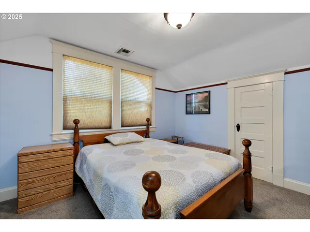 a kitchen with a sink a window and cabinets