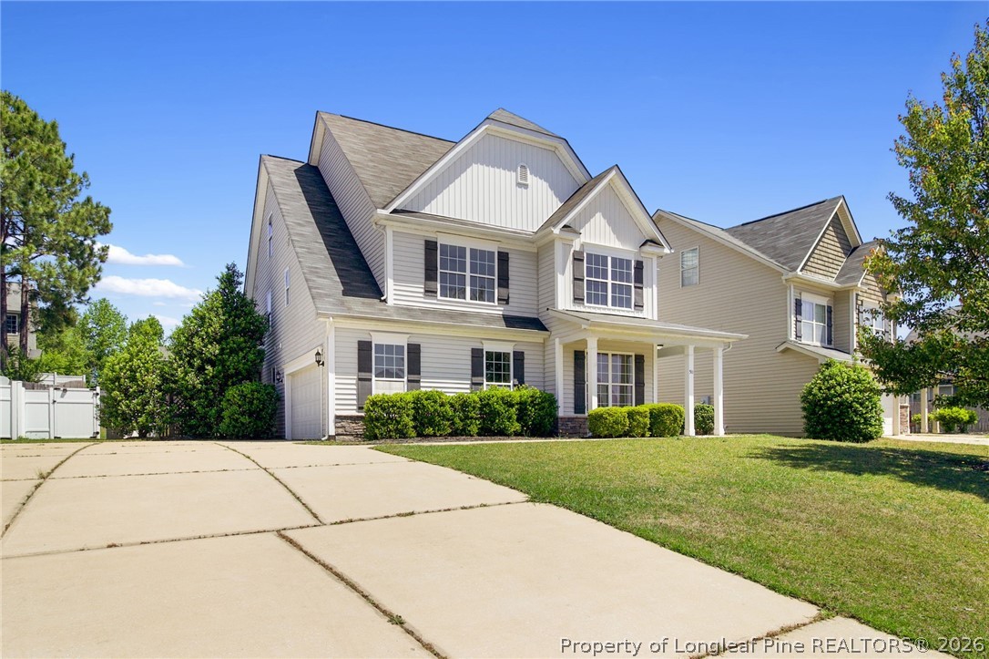 50 Huzzas Circle Cameron, NC 28326 - Photo 2 of 39 a front view of a house with a yard