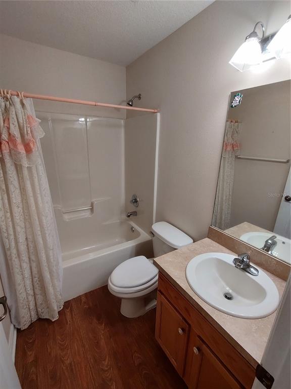 7688 Southwest 77 Place Ocala, FL 34476 - Photo 11 of 16 a bathroom with a sink toilet a mirror and shower