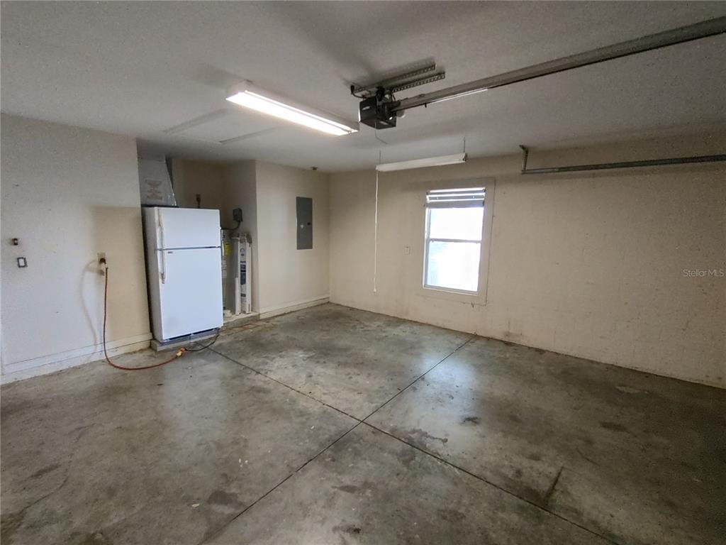 7688 Southwest 77 Place Ocala, FL 34476 - Photo 16 of 16 an empty room with a empty space and windows