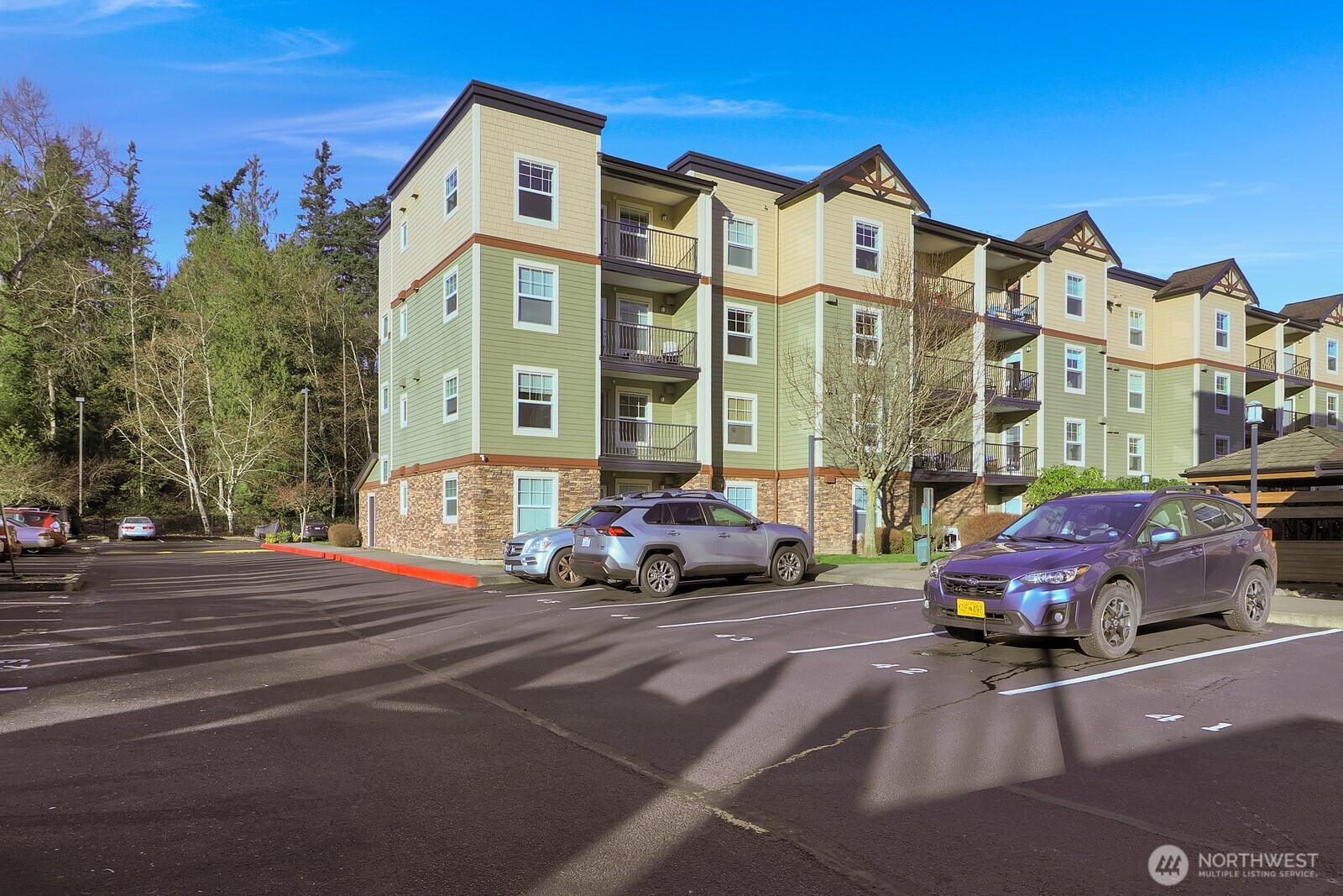 690 32nd Street, Unit B211 Bellingham, WA 98225 - Photo 22 of 23 a cars parked in front of a building