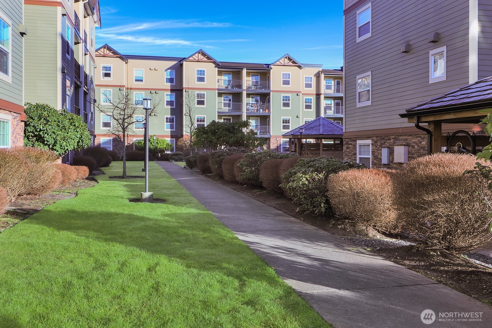 690 32nd Street, Unit B211 Bellingham, WA 98225 - Photo 23 of 23 a front view of a building with garden