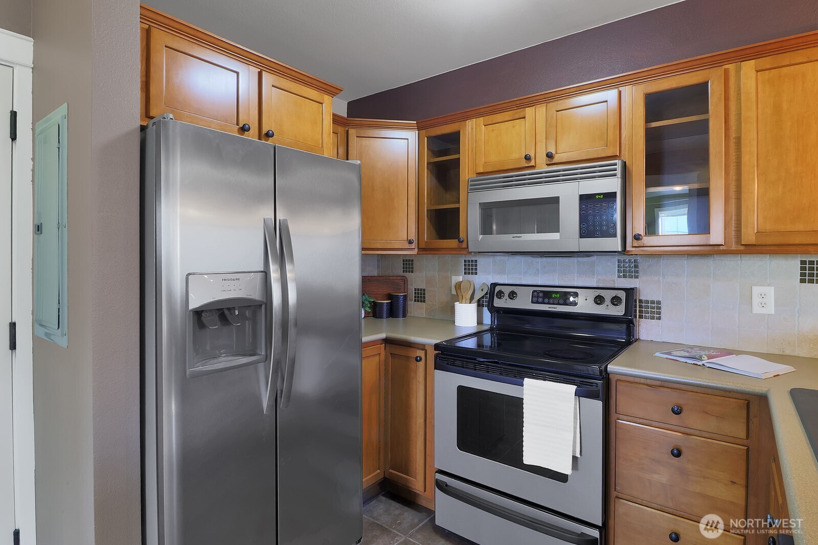 690 32nd Street, Unit B211 Bellingham, WA 98225 - Photo 3 of 23 a kitchen with stainless steel appliances granite countertop a refrigerator stove and cabinets