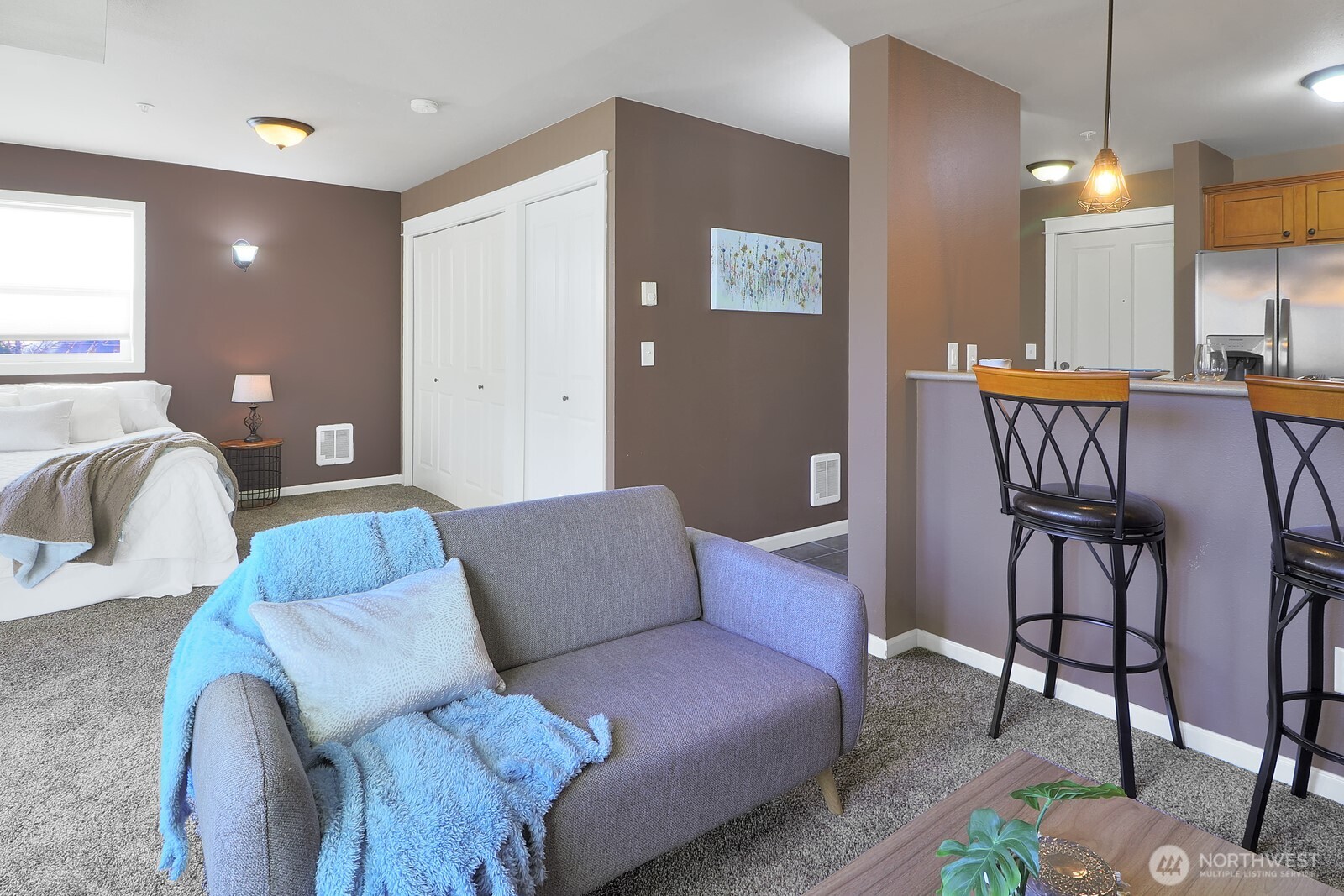 690 32nd Street, Unit B211 Bellingham, WA 98225 - Photo 10 of 23 a living room with furniture and a large window