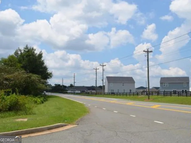 a view of a fountain in front of a house