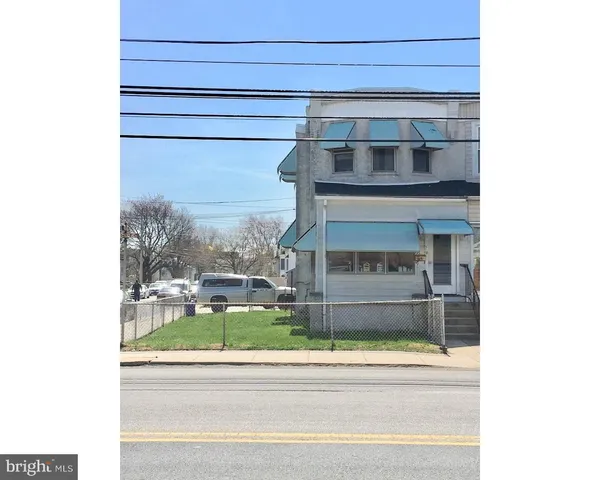 a living room with a fireplace and painted walls