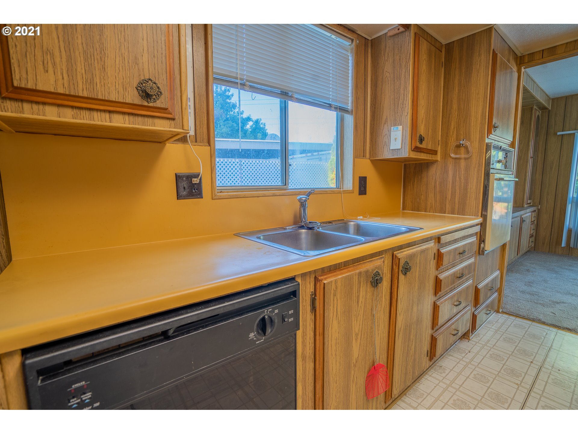 39202 Camp Creek Road, Unit SPC9 Springfield, OR 97478 - Photo 7 of 21 a kitchen with a sink and cabinets