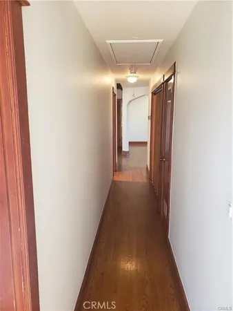 a view of gallery with wooden floor