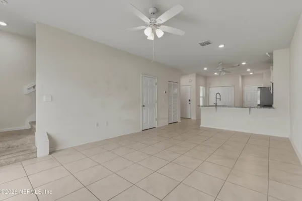 a view of a kitchen with a sink and a window