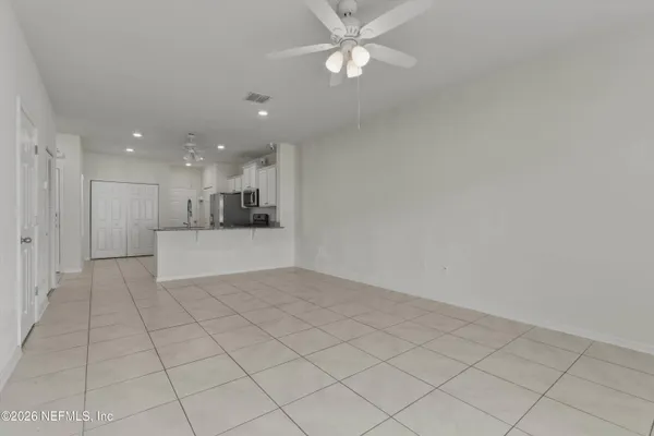 a bathroom with a granite countertop sink and vanity