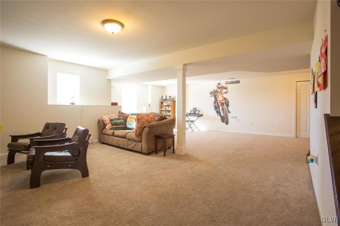 128 Fox Ridge Nazareth, PA 18064 - Photo 35 of 39 a living room with furniture and a piano