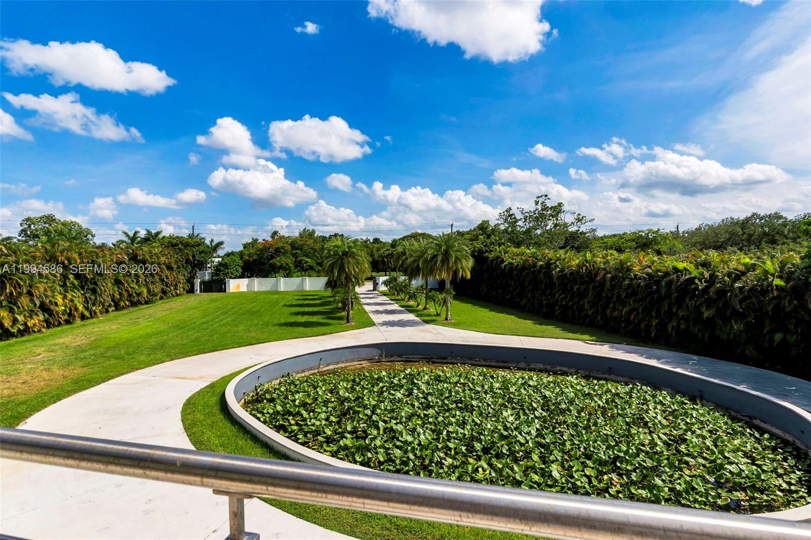 13441 Mustang Trail Southwest Ranches, FL 33330 - Photo 66 of 67 Front open terrace overlooking circular driveway lily pond