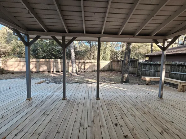 a porch with wooden floor and outdoor space