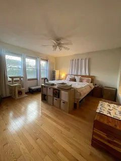 a bed room with furniture and flat screen tv