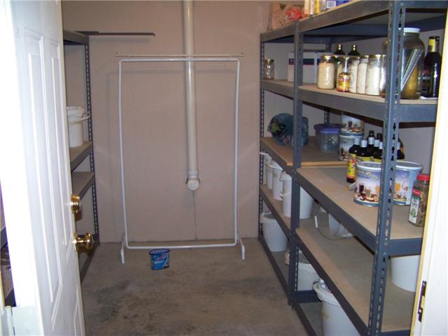 171 Love Lady Hollow Road Tennessee Ridge, TN 37178 - Photo 13 of 20 A HUGE WALK-IN STORAGE PANTRY IS WONDERFUL FOR STOCKING ALL THE EXTRA GOODS YOU WANT TO HAVE "JUST IN CASE".