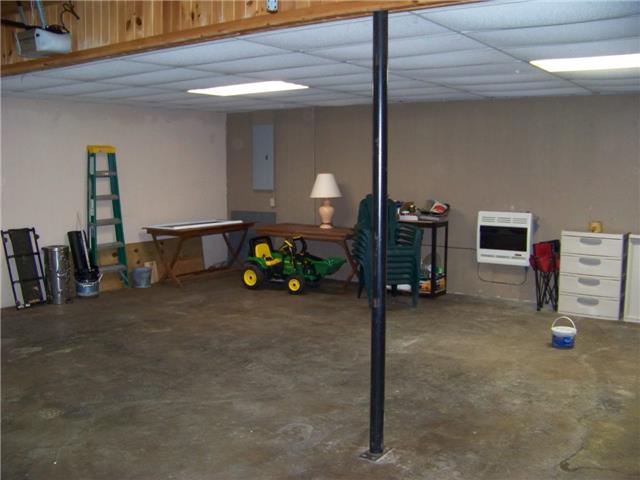 171 Love Lady Hollow Road Tennessee Ridge, TN 37178 - Photo 18 of 20 THERE'S LOTS OF PARKING ROOM AND STORAGE IN THE 2 CAR GARAGE.