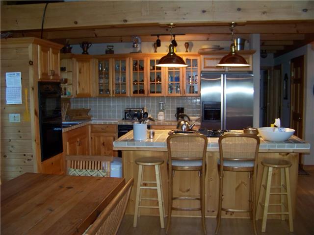 171 Love Lady Hollow Road Tennessee Ridge, TN 37178 - Photo 3 of 20 THE ISLAND HAS AN OVERHANGING BAR BIG ENOUGH FOR 4 STOOLS.