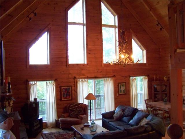 171 Love Lady Hollow Road Tennessee Ridge, TN 37178 - Photo 4 of 20 ALMOST MAJESTIC IN APPEARANCE, THE VAULTED CEILING HAS WINDOWS FROM FLOOR TO CEIILNG.
