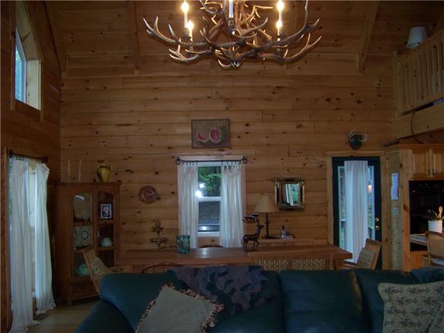 171 Love Lady Hollow Road Tennessee Ridge, TN 37178 - Photo 5 of 20 THIS OPEN DINING AREA BLENDS INTO THE LIVING AREA WITH A DOOR TO THE WRAP-AROUND DECK.