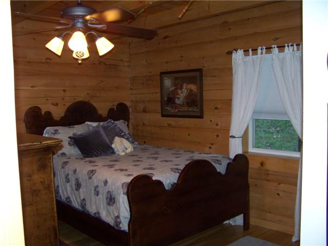 171 Love Lady Hollow Road Tennessee Ridge, TN 37178 - Photo 8 of 20 ANOTHER MAIN FLOOR BEDROOM (14X11) ALSO HAS A BEAMED TONGUE-IN-GROOVE CEILING AND LARGE CLOSET.