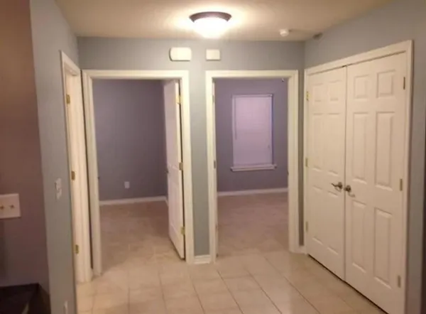 a view of a hallway with closet area