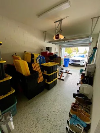 a room with gym equipment and a window