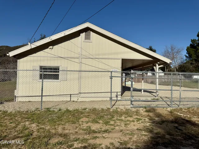 a view of a backyard of a house