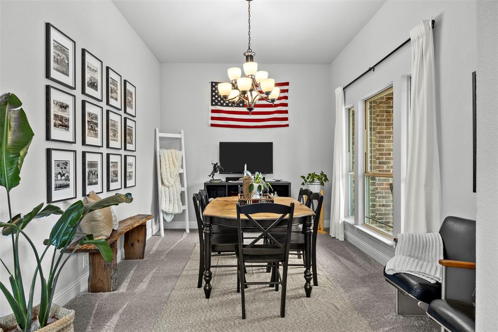 1084 Imperial Eagle Road Alvarado, TX 76009 - Photo 8 of 39 a dining room with furniture a window and a chandelier