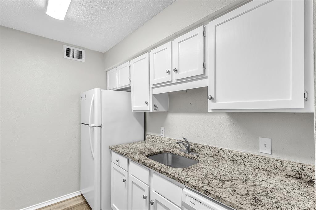 8109 Skillman Street, Unit 2007 Dallas, TX 75231 - Photo 8 of 11 a kitchen with a sink and cabinets