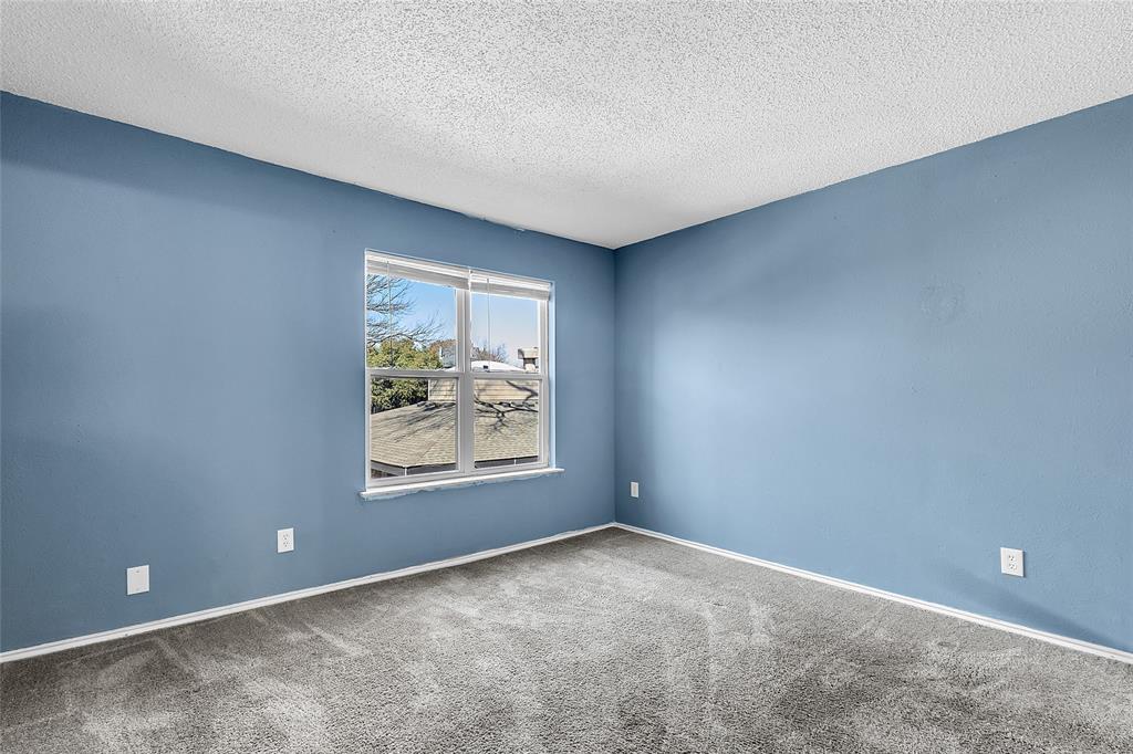 8109 Skillman Street, Unit 2007 Dallas, TX 75231 - Photo 10 of 11 an empty room with windows and closet