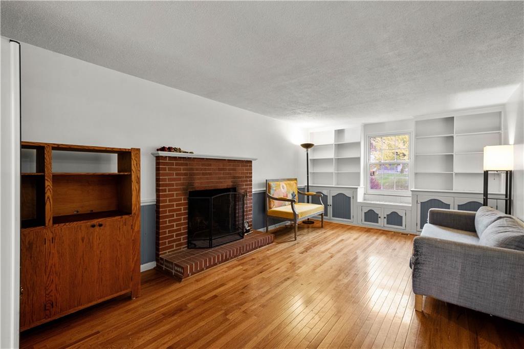 596 Clifton Road Bethel Park, PA 15102 - Photo 14 of 36 a living room with furniture and a flat screen tv