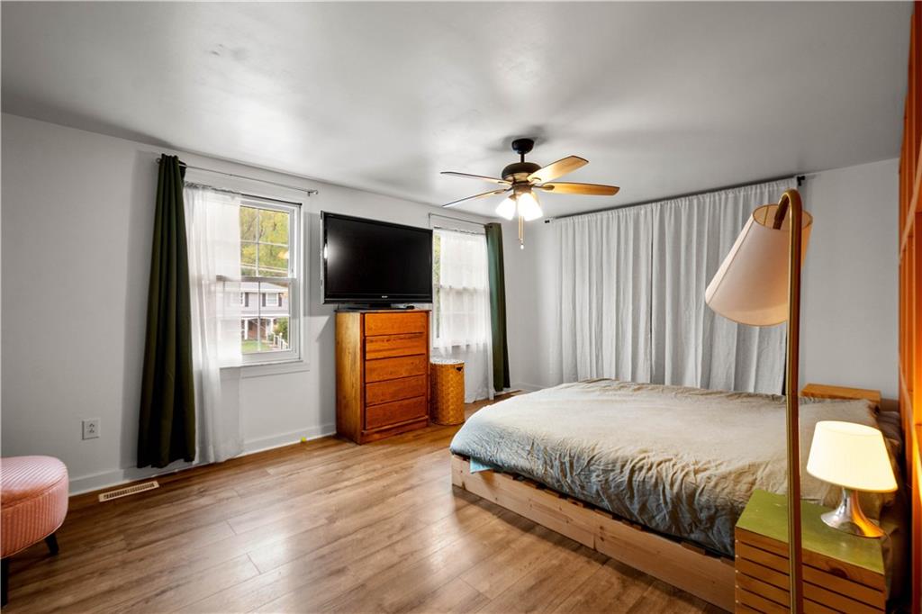 596 Clifton Road Bethel Park, PA 15102 - Photo 20 of 36 a bedroom with a bed and a flat screen tv