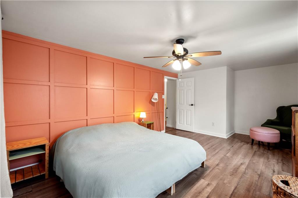 596 Clifton Road Bethel Park, PA 15102 - Photo 21 of 36 a bedroom with a bed and a chandelier