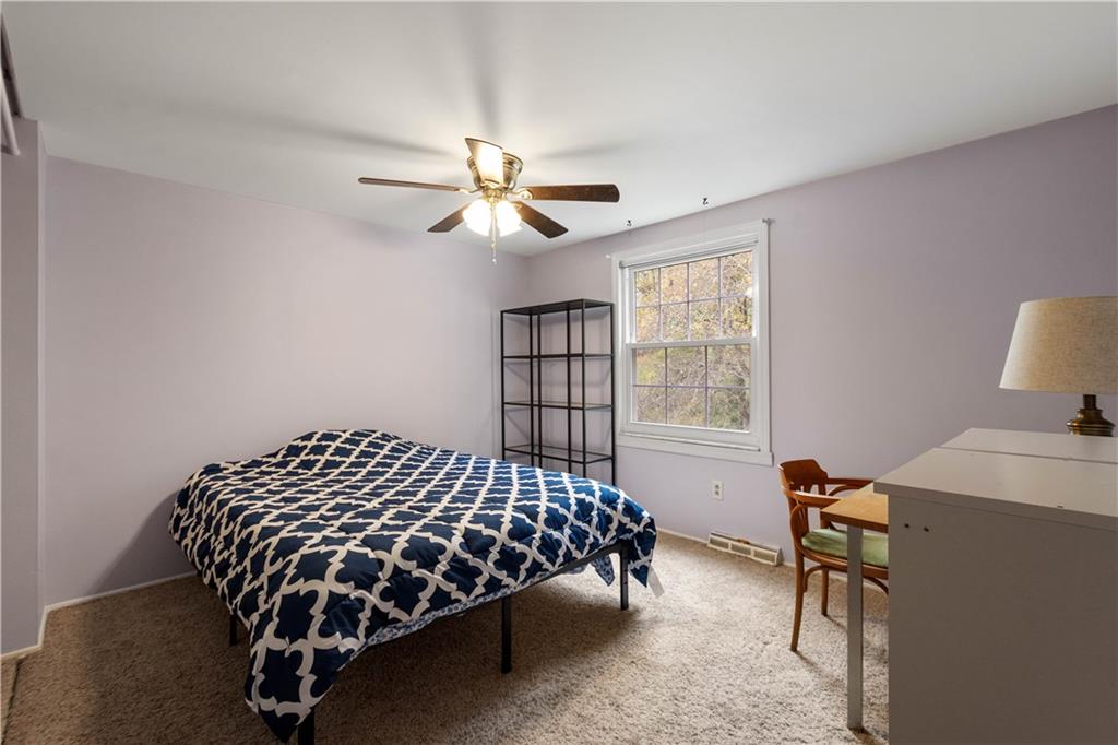 596 Clifton Road Bethel Park, PA 15102 - Photo 23 of 36 a bedroom with a bed chandelier and a window