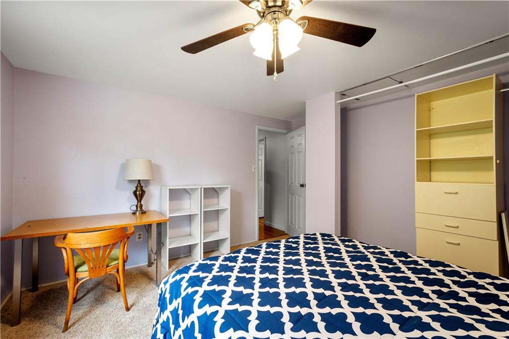 596 Clifton Road Bethel Park, PA 15102 - Photo 24 of 36 a bedroom with a bed and a chandelier
