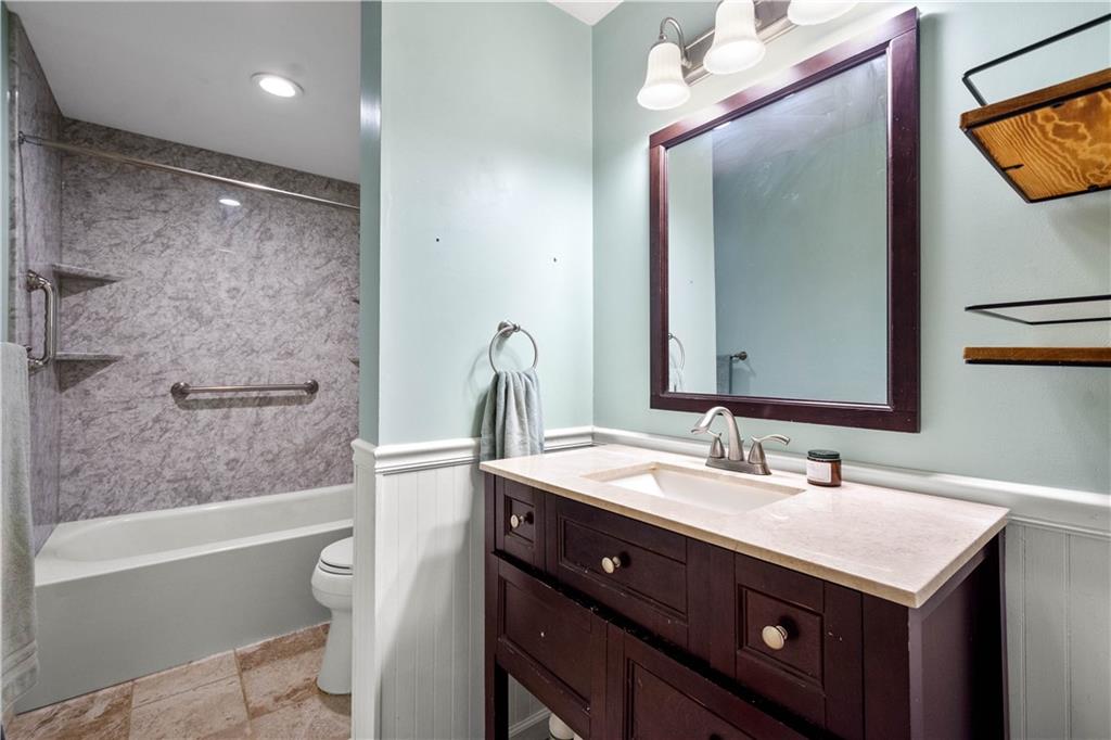 596 Clifton Road Bethel Park, PA 15102 - Photo 25 of 36 a bathroom with a sink vanity tub and a mirror