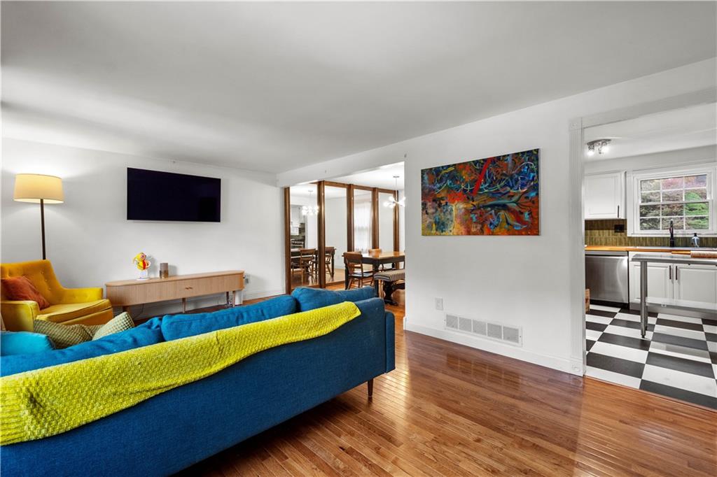 596 Clifton Road Bethel Park, PA 15102 - Photo 3 of 36 a living room with furniture and a flat screen tv