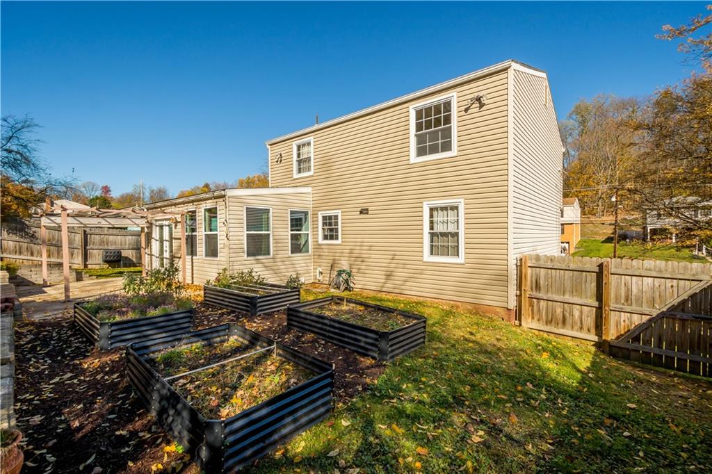596 Clifton Road Bethel Park, PA 15102 - Photo 31 of 36 a backyard of a house with barbeque oven table and chairs