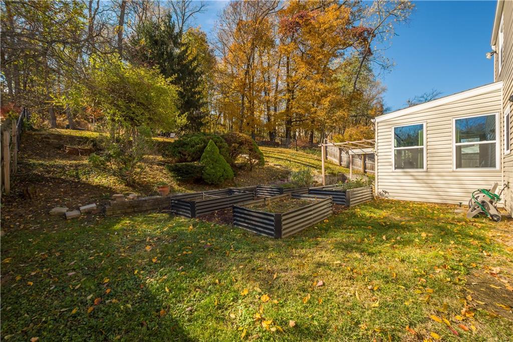 596 Clifton Road Bethel Park, PA 15102 - Photo 33 of 36 a view of a wooden house with a yard