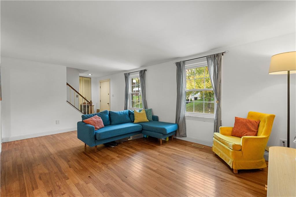 596 Clifton Road Bethel Park, PA 15102 - Photo 5 of 36 a living room with furniture and a wooden floor