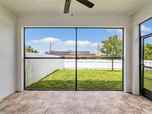 a view of a living room and window