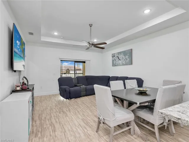 a work room with furniture and a flat screen tv