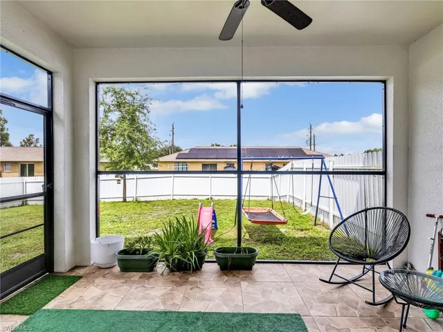 a view of a chairs and table in a yard