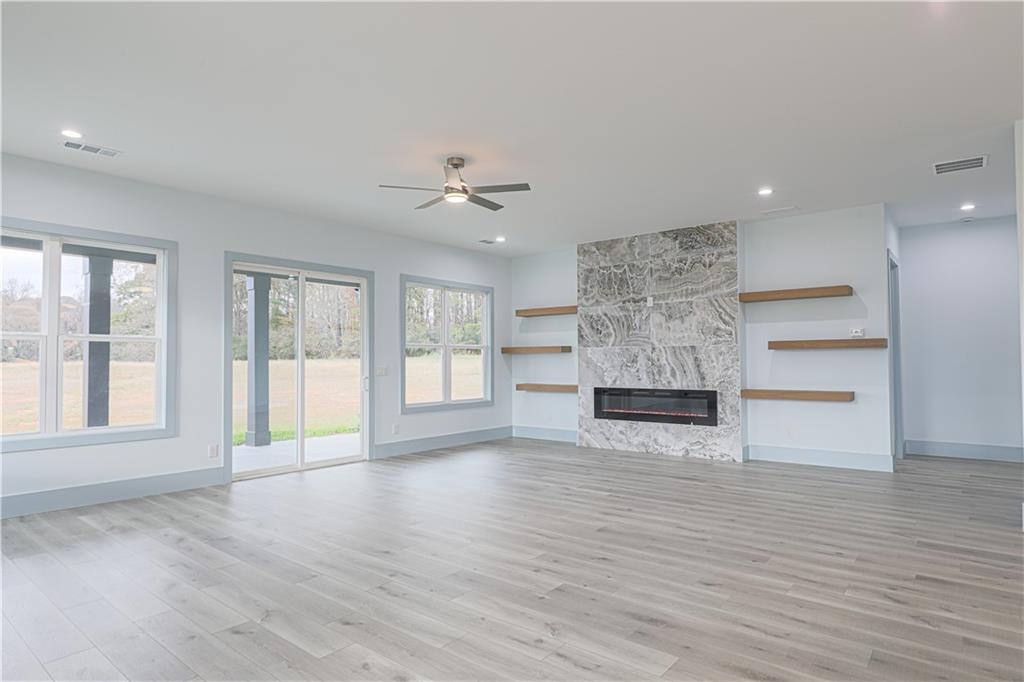 1480 Wheeler Cemetery Road Maysville, GA 30558 - Photo 20 of 50 a view of an empty room with a window and wooden floor