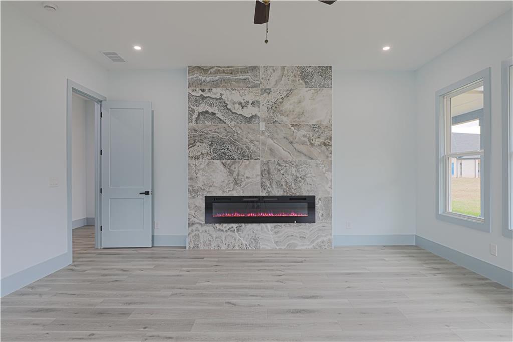 1480 Wheeler Cemetery Road Maysville, GA 30558 - Photo 30 of 50 a view of an empty room with a fireplace and a window
