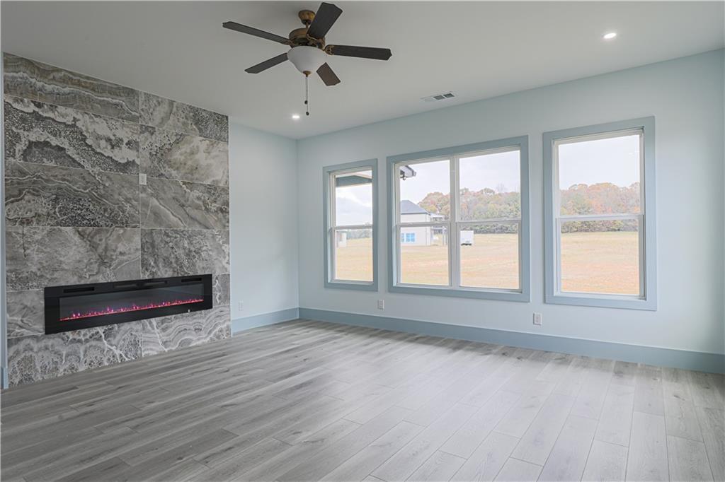 1480 Wheeler Cemetery Road Maysville, GA 30558 - Photo 3 of 50 wooden floor in an empty room with a window