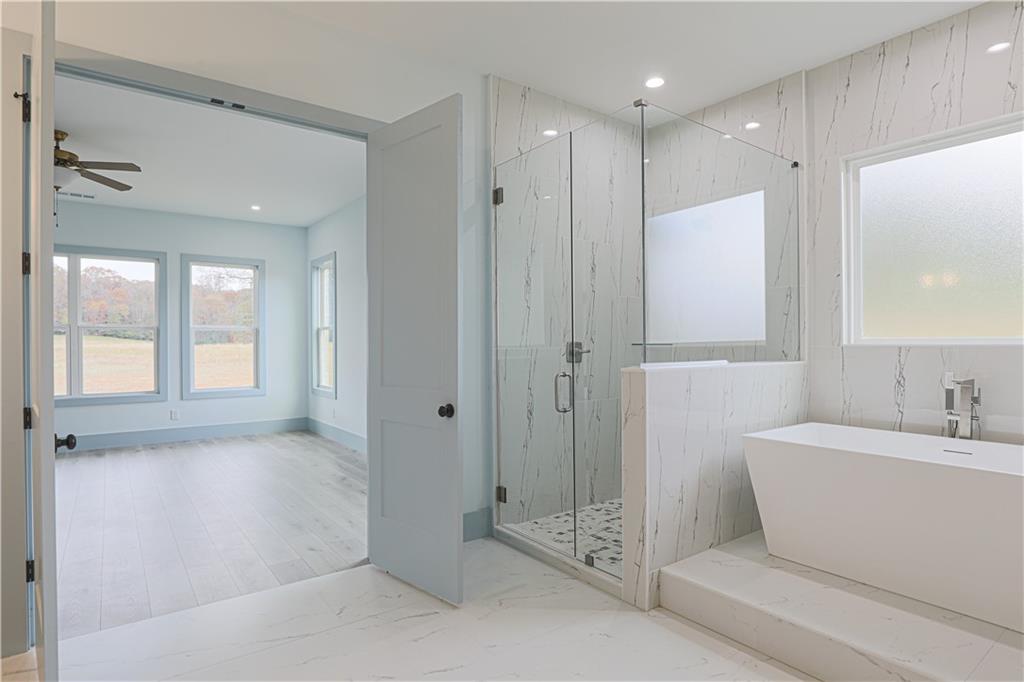 1480 Wheeler Cemetery Road Maysville, GA 30558 - Photo 4 of 50 a bathroom with a shower a sink and a mirror