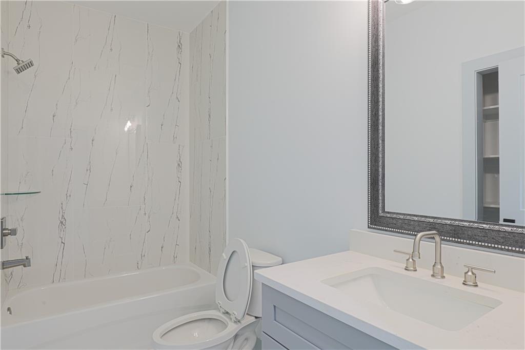 1480 Wheeler Cemetery Road Maysville, GA 30558 - Photo 42 of 50 a bathroom with a sink a toilet and a bathtub