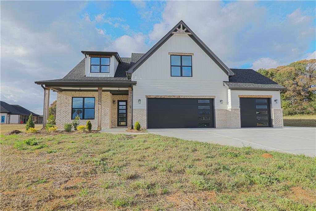 1480 Wheeler Cemetery Road Maysville, GA 30558 - Photo 8 of 50 a front view of a house with a garden