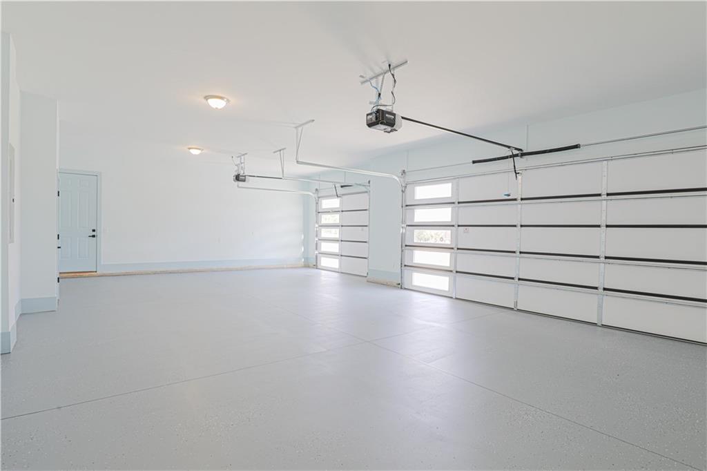 1480 Wheeler Cemetery Road Maysville, GA 30558 - Photo 10 of 50 an empty room with stairs and wooden shelves